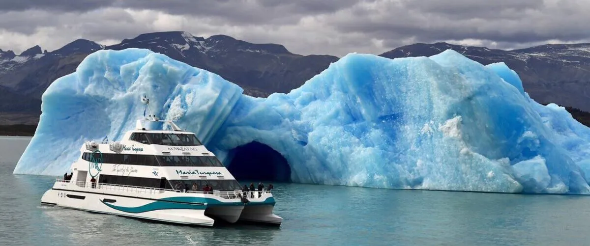 Passengers on the deck of the Glaciares Gourmet cruise ship observing the Perito Moreno Glacier